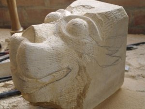 The beginnings of a dragon carved in stone