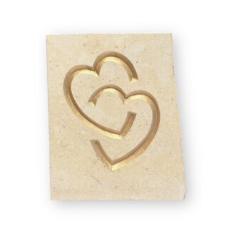 Entwined hearts in Lincoln Cathedral limestone