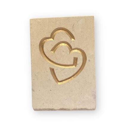 Entwined hearts in Lincoln Cathedral limestone